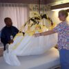 medcare repositioning sling in use handicare 600x600